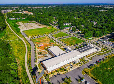Atlanta BeltLine, Inc. purchased 13.7 acres at 356 University Avenue. The purchased property is pictured at the top of this image and adjacent to the Atlanta BeltLine Southside Trail, pictured to the left, and the grassy James Bridges Field and Pittsburgh Yards® in the foreground. Photo by LoKnows Drones.