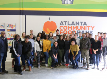 ABI staff pose for a picture at the Atlanta Community Food Bank.