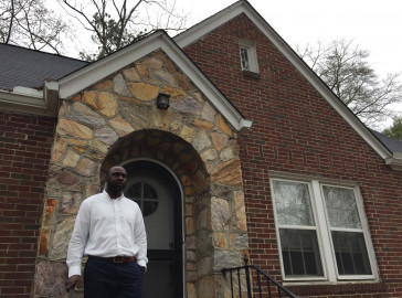 Christopher Causey in front of his Westview home.